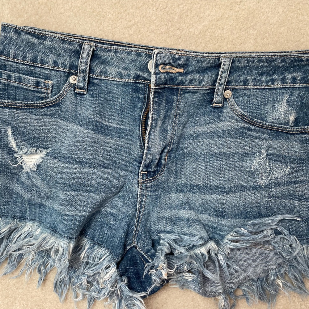 blue shorts with fringe bottom